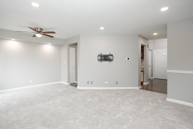 empty room featuring recessed lighting, carpet flooring, ceiling fan, and baseboards