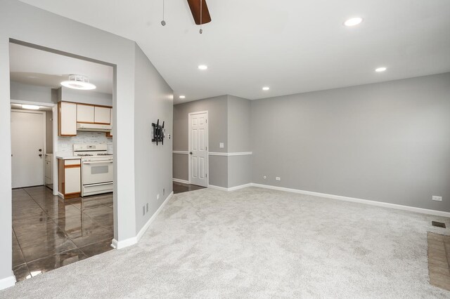 unfurnished room with ceiling fan, carpet floors, recessed lighting, and baseboards