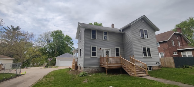 407 Allen St, Belvidere, IL 61008 - view of front of house featuring a chimney, a detached garage, and an outbuilding
