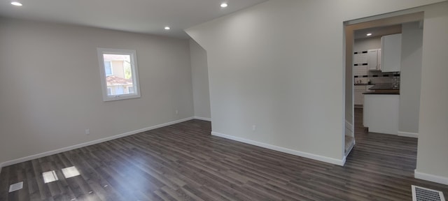 407 Allen St, Belvidere, IL 61008 - empty room with recessed lighting, dark wood finished floors, and baseboards