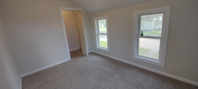 407 Allen St, Belvidere, IL 61008 - carpeted empty room featuring vaulted ceiling and baseboards