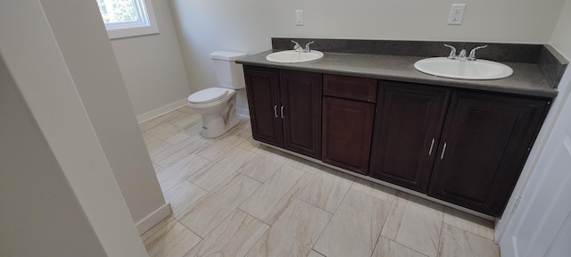 407 Allen St, Belvidere, IL 61008 - full bath featuring toilet, baseboards, and double vanity