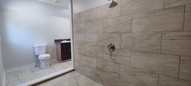 407 Allen St, Belvidere, IL 61008 - bathroom with toilet, a tile shower, and vanity