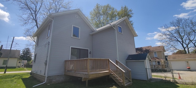407 Allen St, Belvidere, IL 61008 - rear view of house with a wooden deck, an outbuilding, and a garage