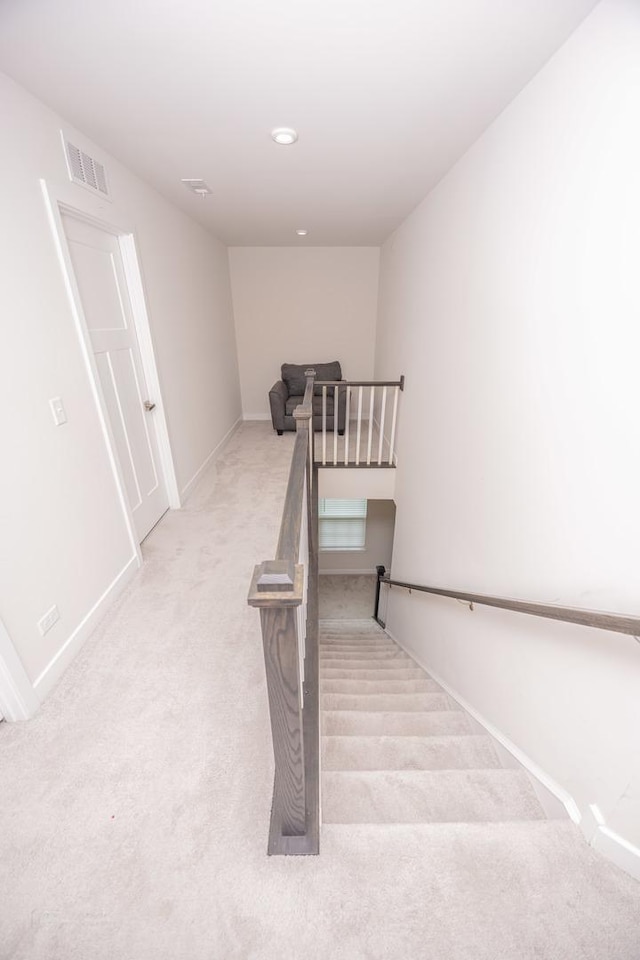 staircase with carpet and baseboards