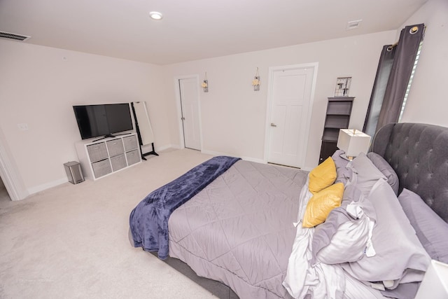 bedroom with carpet and baseboards