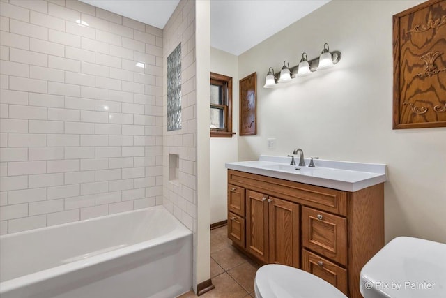 bathroom featuring toilet, tile patterned floors, vanity, and shower / bathtub combination
