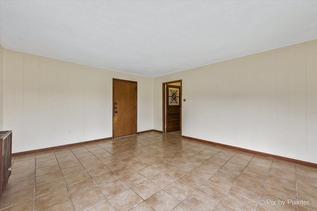 empty room featuring baseboards