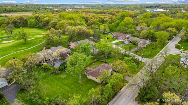 aerial view of residential area featuring a local golf course
