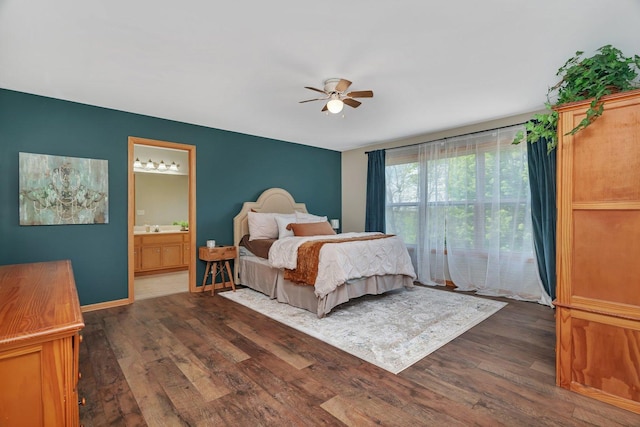 bedroom with wood finished floors, connected bathroom, and ceiling fan