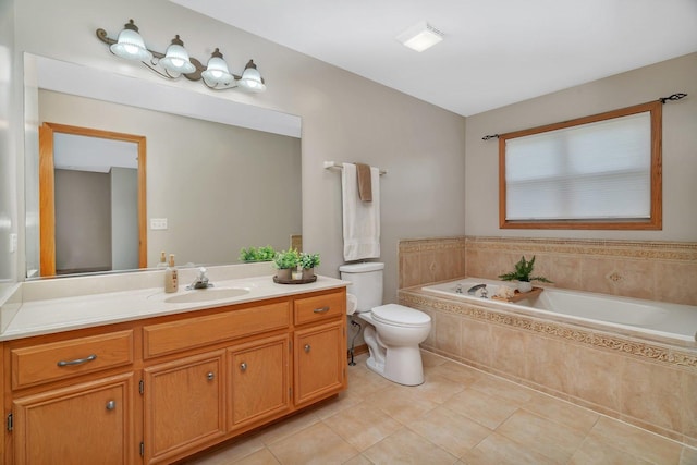 full bath featuring a bath, toilet, vanity, and tile patterned floors