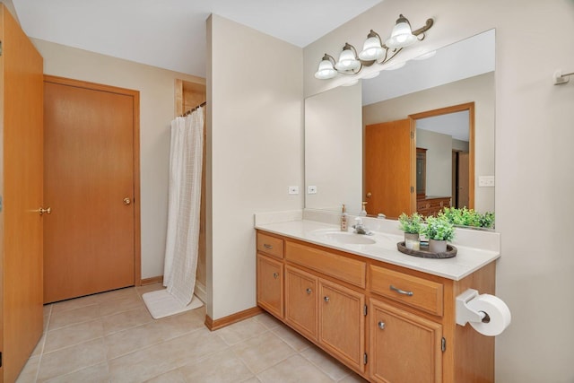 full bath featuring tile patterned flooring, vanity, and curtained shower