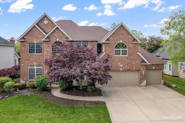 3435 Redwing Dr, Naperville, IL 60564 - traditional home featuring brick siding, driveway, a shingled roof, and a front lawn