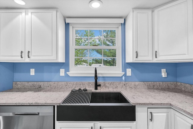 19 Nightingale Cir, Camargo, IL 61919 - kitchen with a sink, stainless steel dishwasher, white cabinetry, and light stone countertops