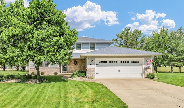 19 Nightingale Cir, Camargo, IL 61919 - view of front of house with an attached garage, brick siding, concrete driveway, and a front yard