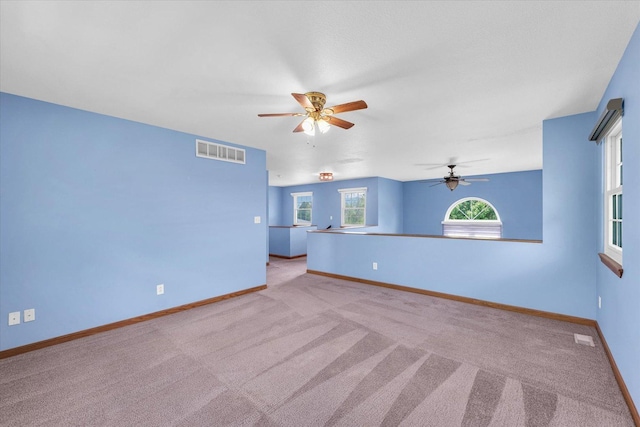 19 Nightingale Cir, Camargo, IL 61919 - unfurnished room with light carpet, ceiling fan, and baseboards