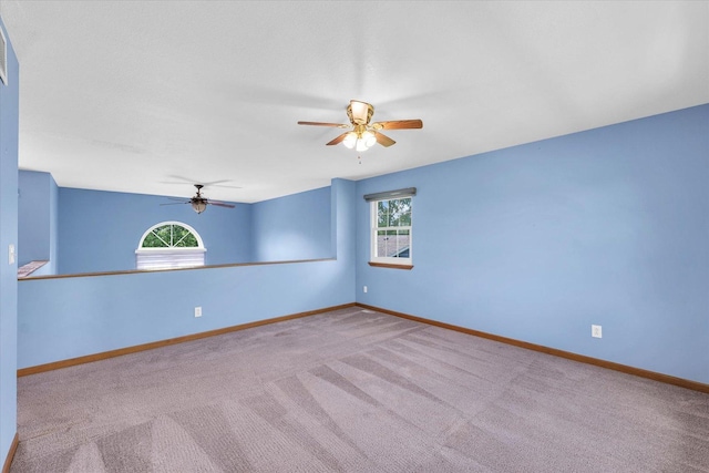 19 Nightingale Cir, Camargo, IL 61919 - carpeted empty room featuring a ceiling fan, plenty of natural light, and baseboards
