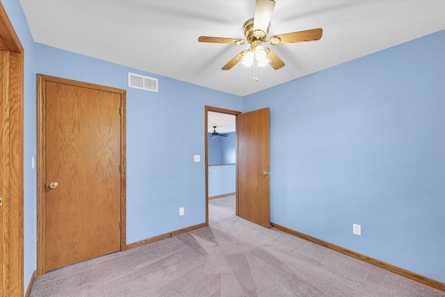 19 Nightingale Cir, Camargo, IL 61919 - unfurnished bedroom with carpet, baseboards, and ceiling fan