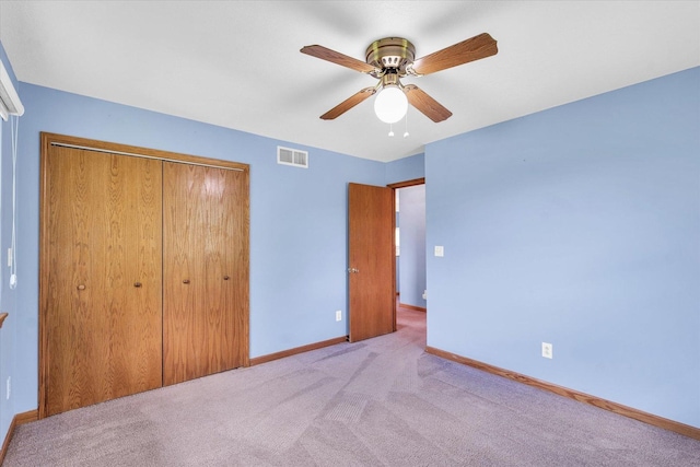 19 Nightingale Cir, Camargo, IL 61919 - unfurnished bedroom featuring a closet, baseboards, carpet, and a ceiling fan