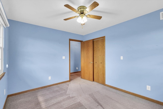 19 Nightingale Cir, Camargo, IL 61919 - unfurnished bedroom with baseboards, a closet, carpet flooring, and ceiling fan