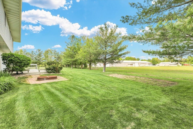 19 Nightingale Cir, Camargo, IL 61919 - view of grassy yard featuring a patio area