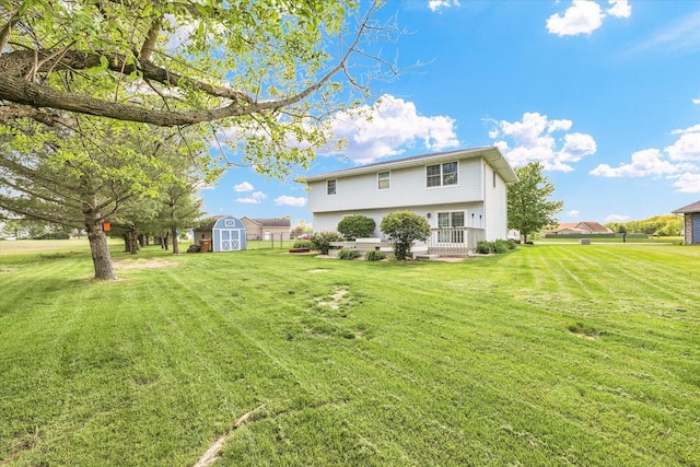 19 Nightingale Cir, Camargo, IL 61919 - rear view of house with a shed, an outdoor structure, and a lawn