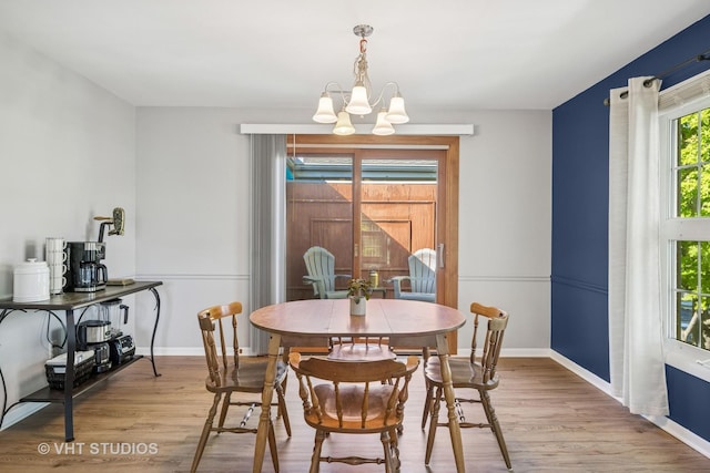 530 Devonshire Ln Unit 12, Crystal Lake, IL 60014 - dining room featuring a chandelier, light wood-style floors, and baseboards