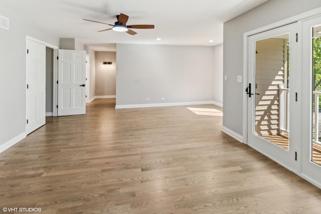 unfurnished room with recessed lighting, a ceiling fan, baseboards, and wood finished floors