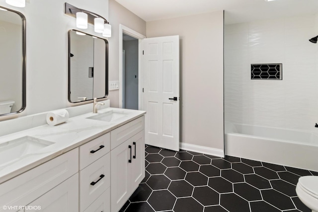 full bath with toilet, tile patterned flooring, double vanity,  shower combination, and baseboards