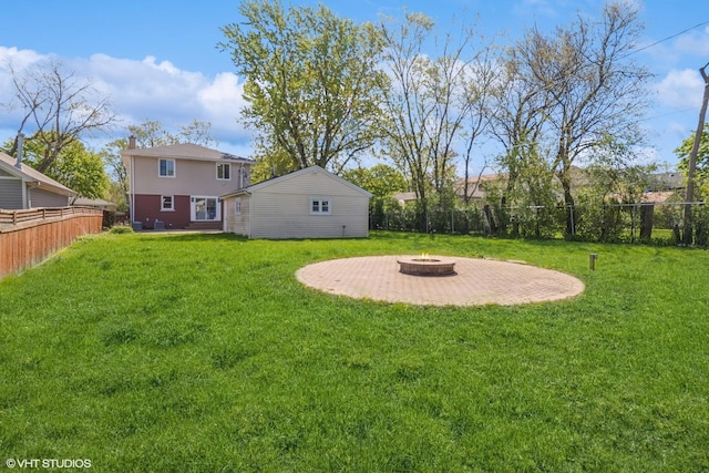 view of yard with a fire pit and a patio area