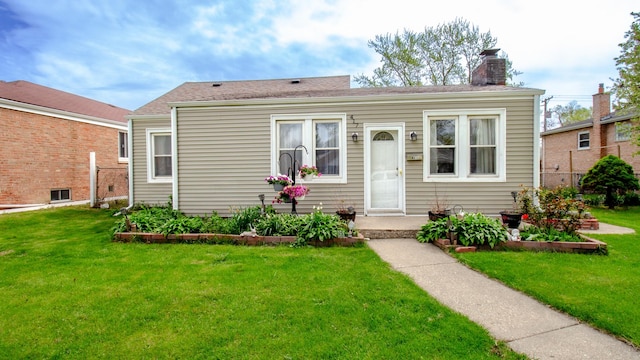 417 52nd Ave, Bellwood, IL 60104 - view of front of property with a chimney and a front lawn