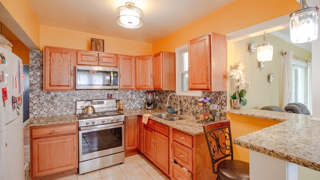 417 52nd Ave, Bellwood, IL 60104 - kitchen featuring stainless steel appliances, a sink, decorative backsplash, light stone countertops, and light tile patterned floors