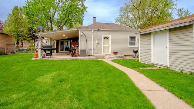417 52nd Ave, Bellwood, IL 60104 - rear view of house featuring a patio area, central air condition unit, a chimney, and a shingled roof