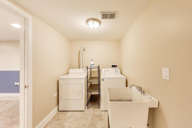 4723 W Shakespeare Ave, Chicago, IL 60639 - laundry area with separate washer and dryer, baseboards, and light tile patterned flooring
