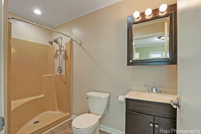 bathroom with a shower, baseboards, toilet, and vanity