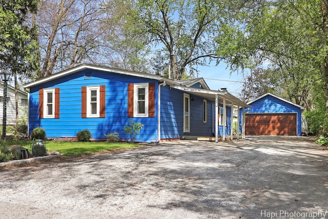 view of front of house with an outdoor structure and a garage