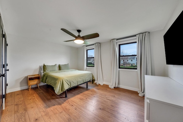 1324 Elmhurst Ln, Schaumburg, IL 60194 - bedroom with baseboards, light wood-style floors, and ceiling fan