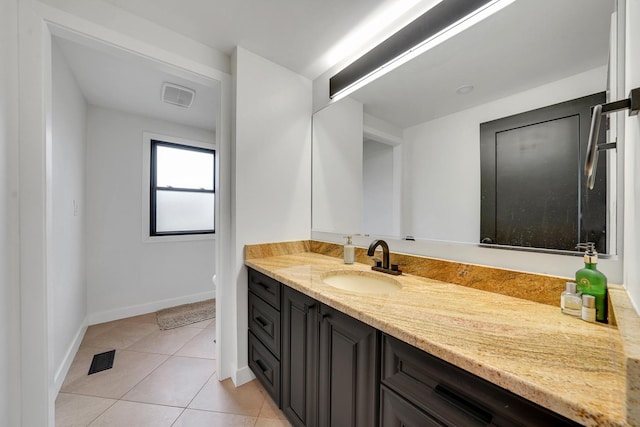 1324 Elmhurst Ln, Schaumburg, IL 60194 - bathroom featuring tile patterned floors, baseboards, and vanity
