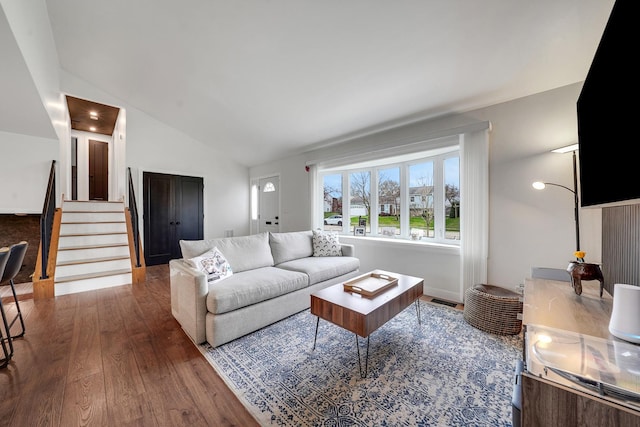 1324 Elmhurst Ln, Schaumburg, IL 60194 - living area featuring lofted ceiling, wood finished floors, and stairway