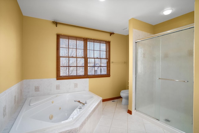 bathroom with a stall shower, toilet, a tub with jets, tile patterned floors, and baseboards
