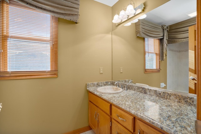 bathroom featuring vanity and baseboards