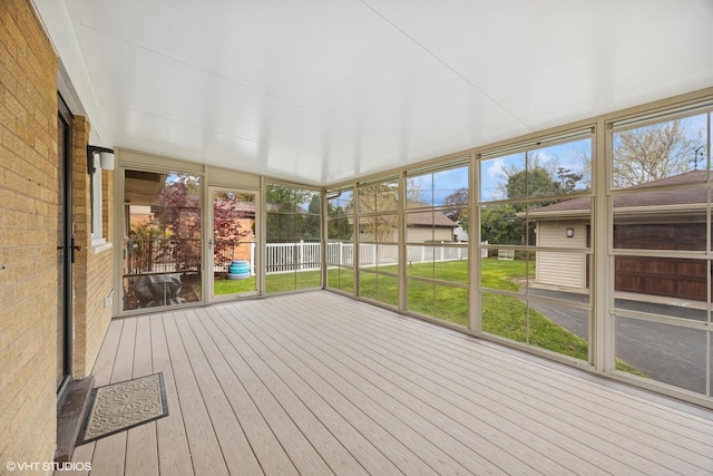unfurnished sunroom with plenty of natural light