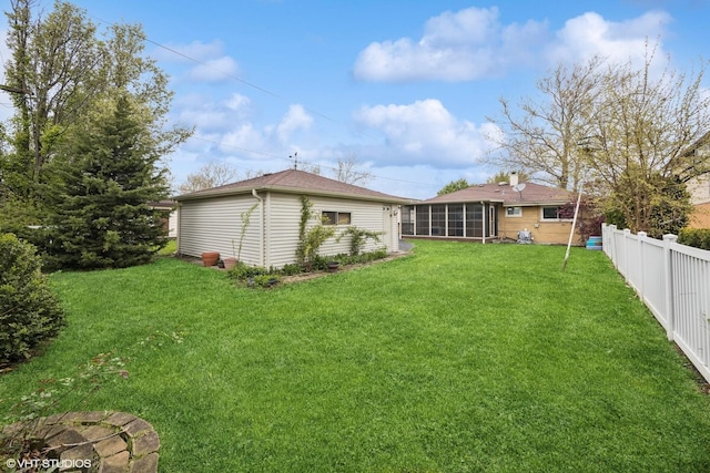 view of yard with a sunroom