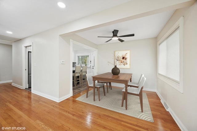 dining room featuring a ceiling fan, baseboards, light wood-type flooring, and recessed lighting