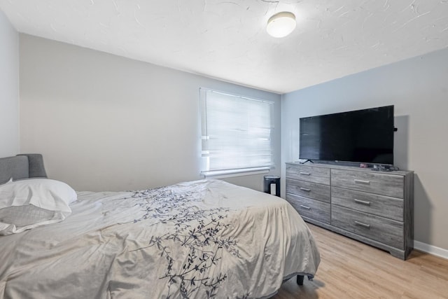 bedroom featuring light wood finished floors