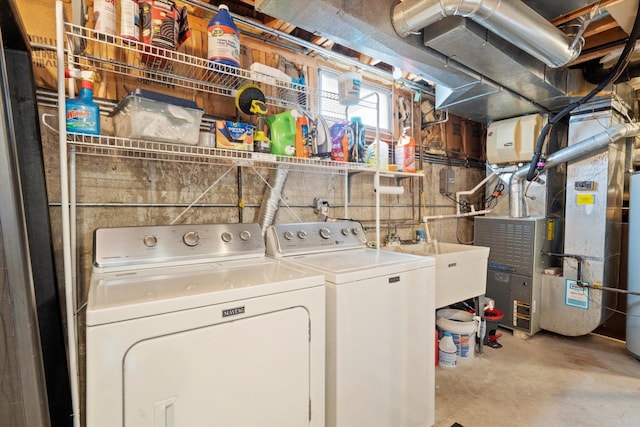 laundry room featuring separate washer and dryer and heating unit