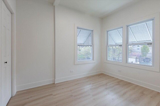 1808 N Karlov Ave, Chicago, IL 60639 - unfurnished room featuring light wood-style flooring and baseboards
