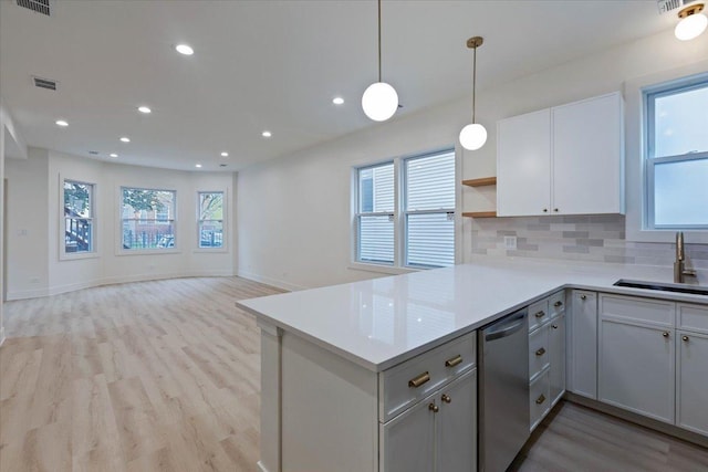 1808 N Karlov Ave, Chicago, IL 60639 - kitchen with a sink, light wood-style floors, stainless steel dishwasher, healthy amount of natural light, and recessed lighting