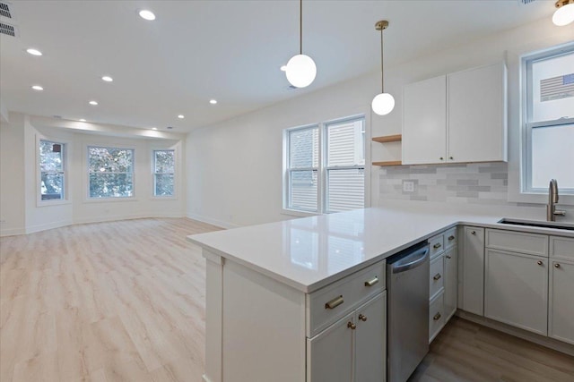 1808 N Karlov Ave, Chicago, IL 60639 - kitchen with a sink, light wood-style flooring, stainless steel dishwasher, plenty of natural light, and recessed lighting