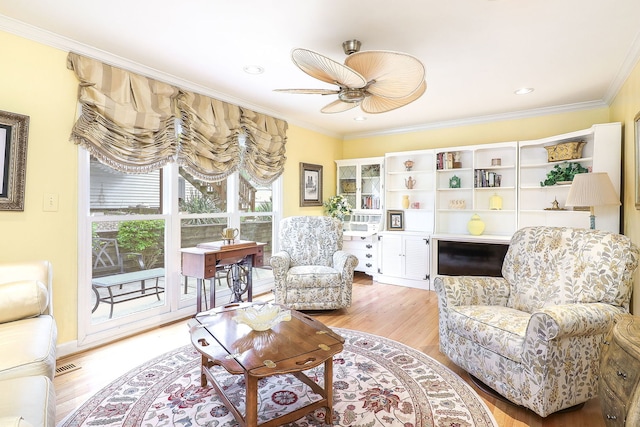 1054 Evergreen Dr, Carol Stream, IL 60188 - living room featuring light wood-type flooring, ornamental molding, ceiling fan, and recessed lighting